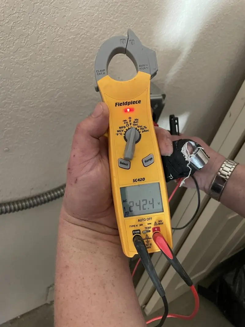 Voltage testing with clamp meter during Electrical Installation Services in West Point